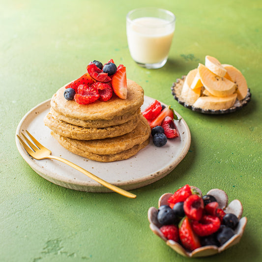 Stacked protein pancakes with mixed berries